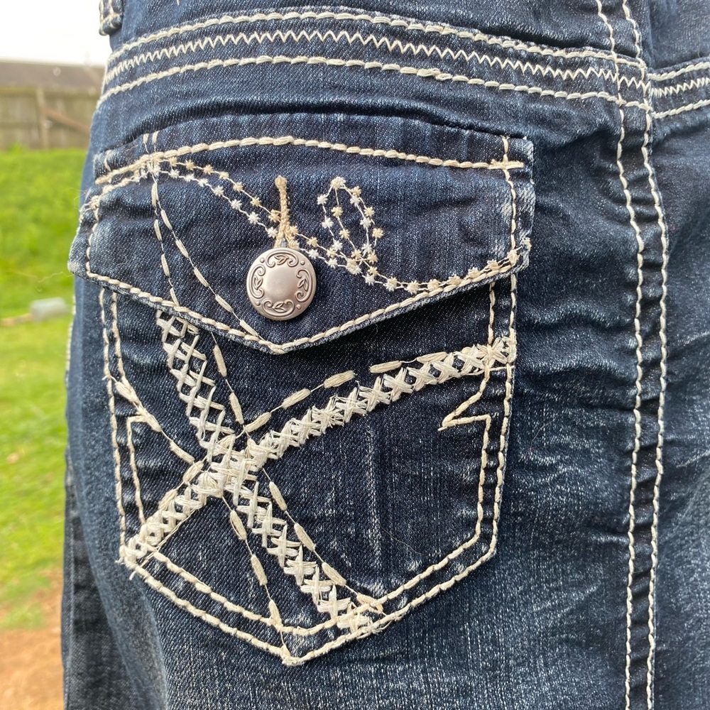 Denim mini skirt with detailed stitching.